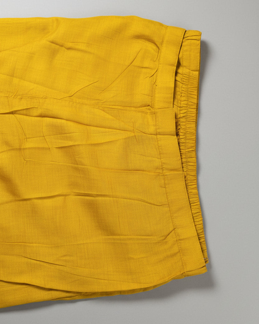 Yellow Raw silk fabric with cut work bead design.