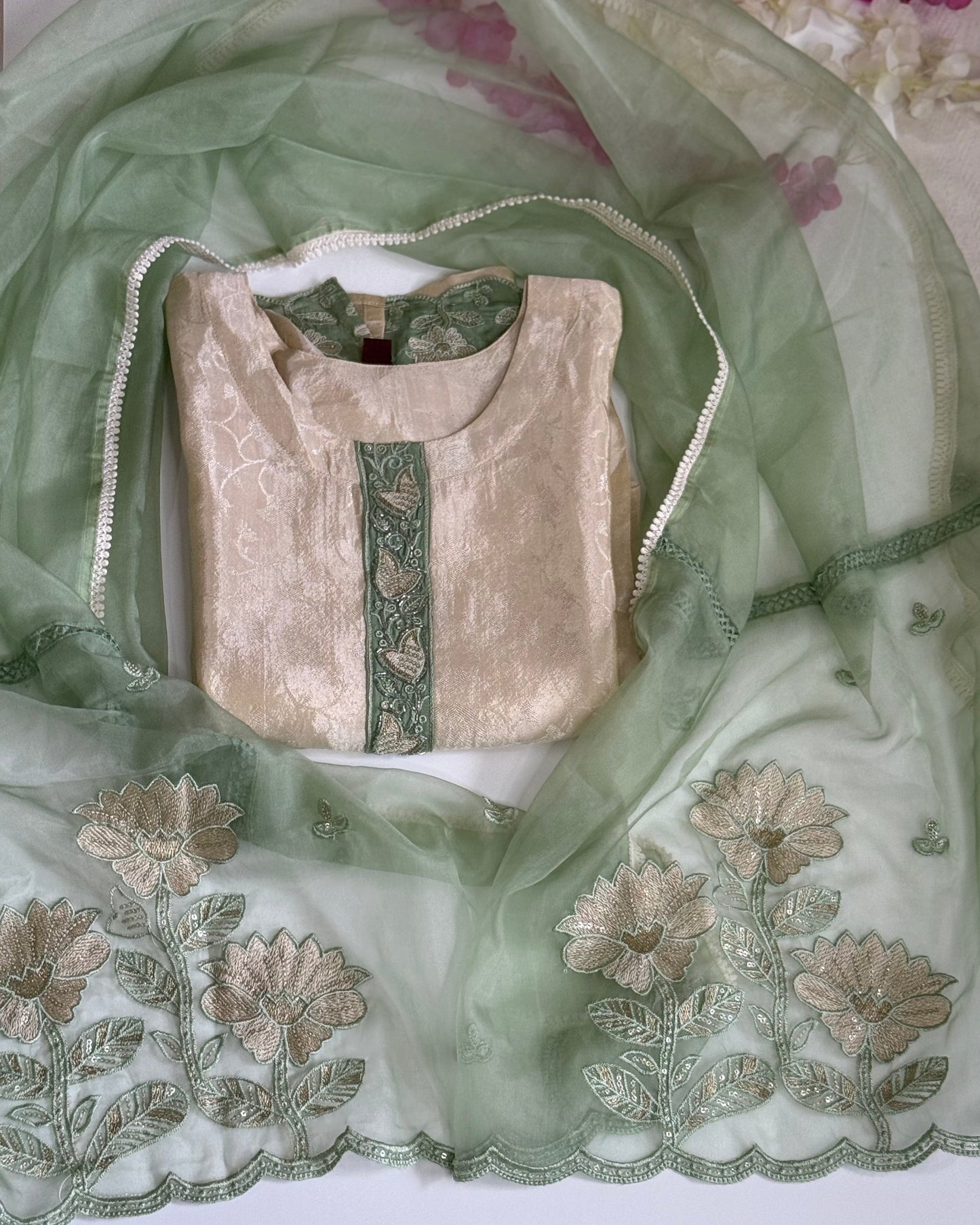 Crepe Jacquard Beige kurta with green embroidery.
